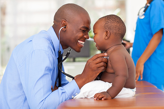 doctor using stethescope on child